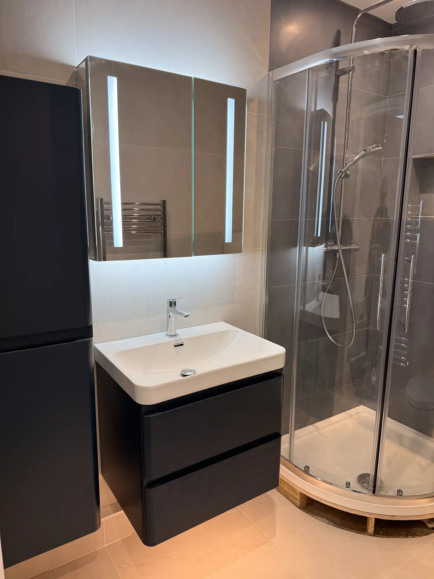 Illuminated bathroom mirror and lighting