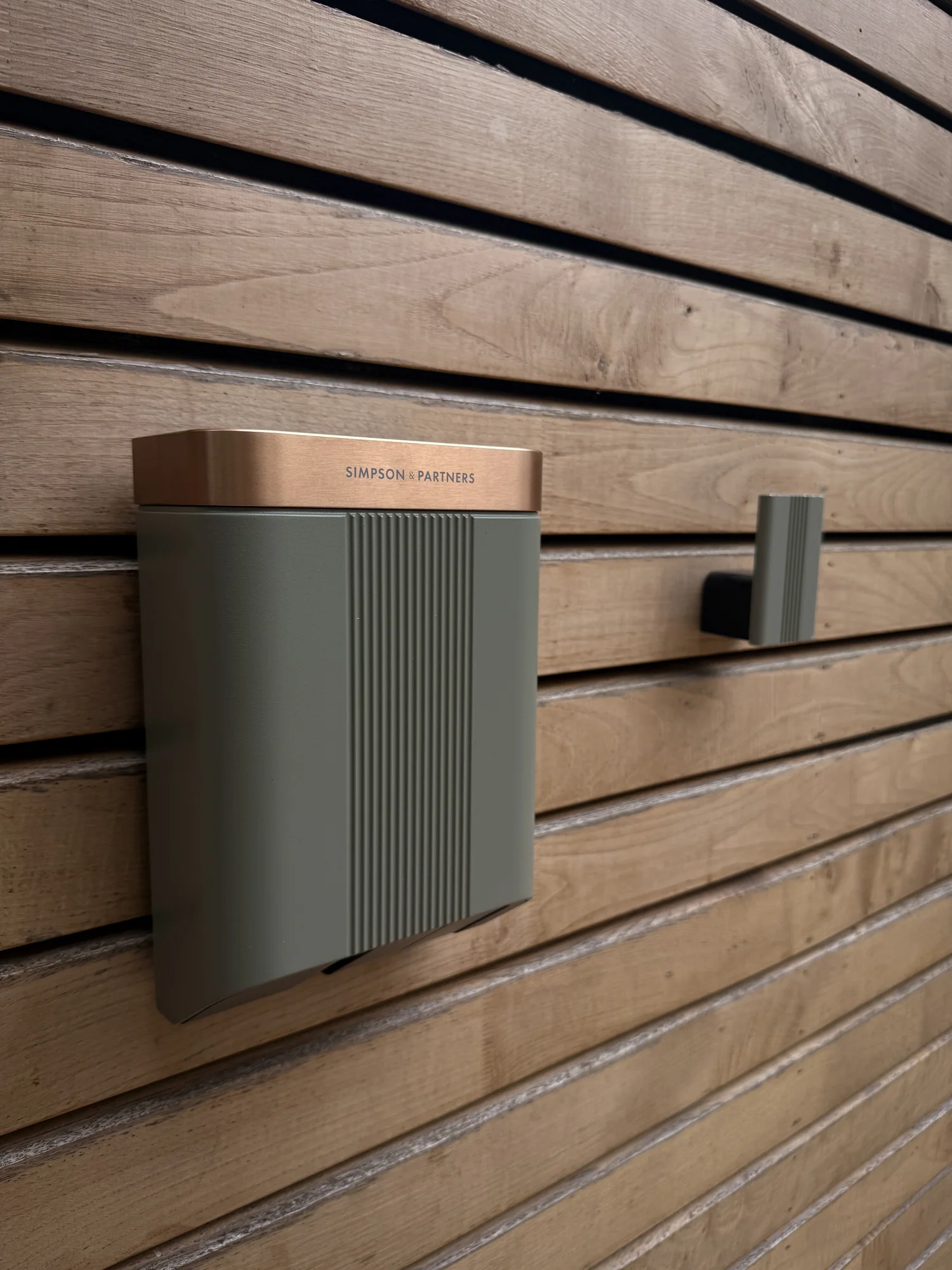 Simpson & Partners EV charger fitted by TB Electrical on timber cladding
